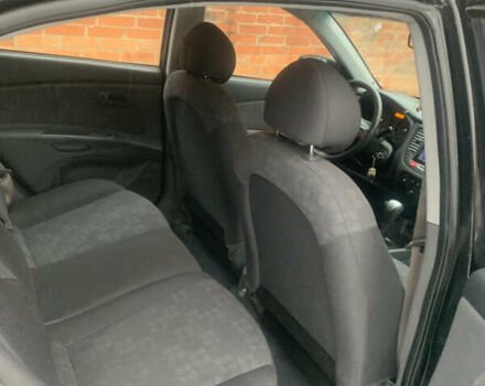 Черный Киа Рио, объемом двигателя 1.4 л и пробегом 86 тыс. км за 5300 $, фото 12 на Automoto.ua