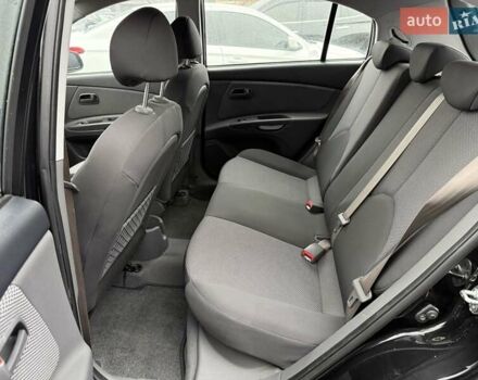 Черный Киа Рио, объемом двигателя 1.4 л и пробегом 166 тыс. км за 6000 $, фото 13 на Automoto.ua