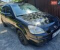 Чорний Кіа Ріо, об'ємом двигуна 1.4 л та пробігом 390 тис. км за 3500 $, фото 1 на Automoto.ua