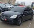Черный Киа Рио, объемом двигателя 1.4 л и пробегом 274 тыс. км за 5290 $, фото 1 на Automoto.ua