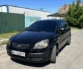 Черный Киа Рио, объемом двигателя 1.4 л и пробегом 240 тыс. км за 5200 $, фото 1 на Automoto.ua