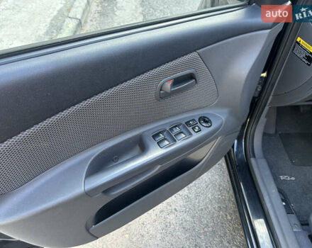 Чорний Кіа Ріо, об'ємом двигуна 1.4 л та пробігом 166 тис. км за 6100 $, фото 3 на Automoto.ua