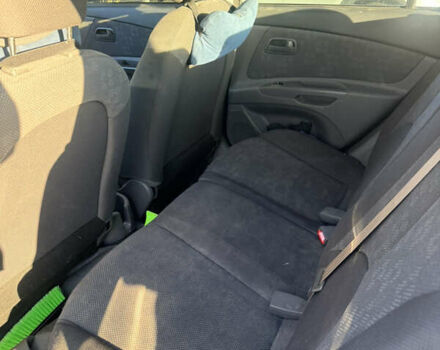 Чорний Кіа Ріо, об'ємом двигуна 1.4 л та пробігом 208 тис. км за 6200 $, фото 7 на Automoto.ua