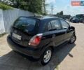 Чорний Кіа Ріо, об'ємом двигуна 1.4 л та пробігом 180 тис. км за 5999 $, фото 2 на Automoto.ua