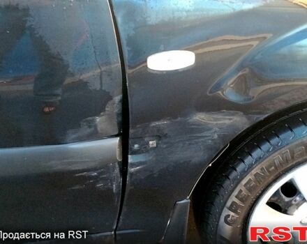 Черный Киа Рио, объемом двигателя 1.4 л и пробегом 349 тыс. км за 2599 $, фото 8 на Automoto.ua