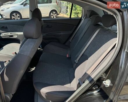 Чорний Кіа Ріо, об'ємом двигуна 1.4 л та пробігом 180 тис. км за 5999 $, фото 14 на Automoto.ua