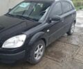 Чорний Кіа Ріо, об'ємом двигуна 1.4 л та пробігом 253 тис. км за 3518 $, фото 1 на Automoto.ua