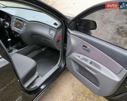 Чорний Кіа Ріо, об'ємом двигуна 1.4 л та пробігом 198 тис. км за 5200 $, фото 9 на Automoto.ua