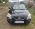 Черный Киа Рио, объемом двигателя 1.4 л и пробегом 260 тыс. км за 3450 $, фото 1 на Automoto.ua