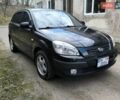 Чорний Кіа Ріо, об'ємом двигуна 1.4 л та пробігом 198 тис. км за 5200 $, фото 1 на Automoto.ua