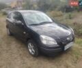 Черный Киа Рио, объемом двигателя 1.4 л и пробегом 260 тыс. км за 3450 $, фото 2 на Automoto.ua