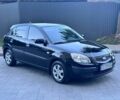 Черный Киа Рио, объемом двигателя 1.4 л и пробегом 111 тыс. км за 4999 $, фото 1 на Automoto.ua