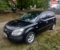 Черный Киа Рио, объемом двигателя 1.4 л и пробегом 260 тыс. км за 3450 $, фото 1 на Automoto.ua