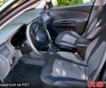 Чорний Кіа Ріо, об'ємом двигуна 1.4 л та пробігом 185 тис. км за 3800 $, фото 2 на Automoto.ua