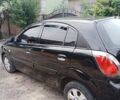 Черный Киа Рио, объемом двигателя 1.4 л и пробегом 273 тыс. км за 5700 $, фото 2 на Automoto.ua