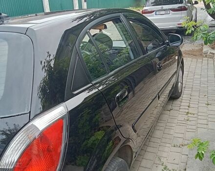 Чорний Кіа Ріо, об'ємом двигуна 1.4 л та пробігом 274 тис. км за 5800 $, фото 3 на Automoto.ua