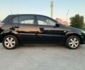 Черный Киа Рио, объемом двигателя 1.4 л и пробегом 200 тыс. км за 6300 $, фото 1 на Automoto.ua