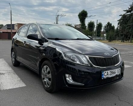 Черный Киа Рио, объемом двигателя 1.59 л и пробегом 127 тыс. км за 7600 $, фото 1 на Automoto.ua