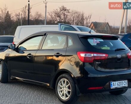 Чорний Кіа Ріо, об'ємом двигуна 1.4 л та пробігом 169 тис. км за 4499 $, фото 4 на Automoto.ua