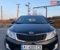 Чорний Кіа Ріо, об'ємом двигуна 1.4 л та пробігом 169 тис. км за 4499 $, фото 1 на Automoto.ua