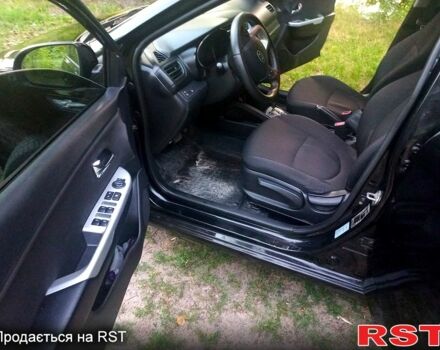Чорний Кіа Ріо, об'ємом двигуна 1.6 л та пробігом 113 тис. км за 8500 $, фото 6 на Automoto.ua