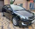 Черный Киа Рио, объемом двигателя 1.4 л и пробегом 172 тыс. км за 5700 $, фото 2 на Automoto.ua