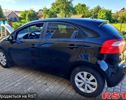 Чорний Кіа Ріо, об'ємом двигуна 1.6 л та пробігом 144 тис. км за 7300 $, фото 2 на Automoto.ua