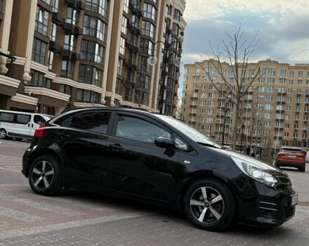 Чорний Кіа Ріо, об'ємом двигуна 1.4 л та пробігом 74 тис. км за 12500 $, фото 6 на Automoto.ua