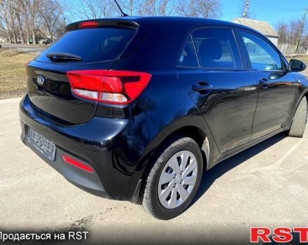 Чорний Кіа Ріо, об'ємом двигуна 1.4 л та пробігом 89 тис. км за 12700 $, фото 2 на Automoto.ua