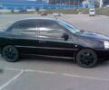 Черный Киа Рио, объемом двигателя 1.4 л и пробегом 214 тыс. км за 4500 $, фото 1 на Automoto.ua