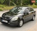Чорний Кіа Ріо, об'ємом двигуна 1.4 л та пробігом 252 тис. км за 4750 $, фото 1 на Automoto.ua