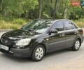 Чорний Кіа Ріо, об'ємом двигуна 1.4 л та пробігом 252 тис. км за 4750 $, фото 1 на Automoto.ua