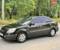 Чорний Кіа Ріо, об'ємом двигуна 1.4 л та пробігом 252 тис. км за 4750 $, фото 2 на Automoto.ua
