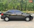 Чорний Кіа Ріо, об'ємом двигуна 1.4 л та пробігом 252 тис. км за 4750 $, фото 12 на Automoto.ua