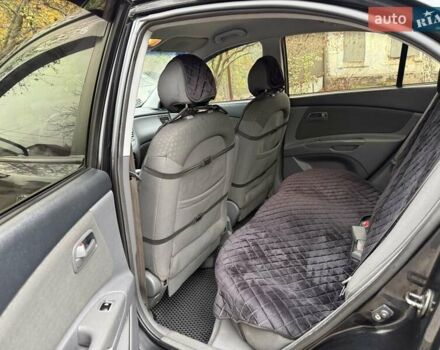 Чорний Кіа Ріо, об'ємом двигуна 1.4 л та пробігом 200 тис. км за 5000 $, фото 4 на Automoto.ua