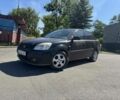 Черный Киа Рио, объемом двигателя 1.4 л и пробегом 200 тыс. км за 3400 $, фото 1 на Automoto.ua