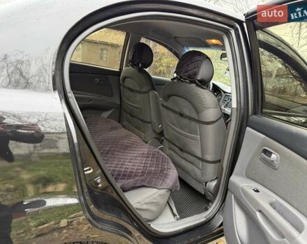 Чорний Кіа Ріо, об'ємом двигуна 1.4 л та пробігом 200 тис. км за 5000 $, фото 6 на Automoto.ua