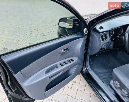 Черный Киа Рио, объемом двигателя 1.4 л и пробегом 297 тыс. км за 3999 $, фото 18 на Automoto.ua