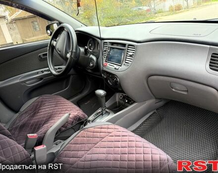 Чорний Кіа Ріо, об'ємом двигуна 1.4 л та пробігом 199 тис. км за 5500 $, фото 3 на Automoto.ua