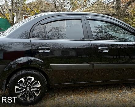 Чорний Кіа Ріо, об'ємом двигуна 1.4 л та пробігом 199 тис. км за 5500 $, фото 4 на Automoto.ua