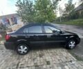 Чорний Кіа Ріо, об'ємом двигуна 1.4 л та пробігом 249 тис. км за 3500 $, фото 1 на Automoto.ua