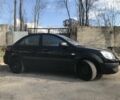 Чорний Кіа Ріо, об'ємом двигуна 1.4 л та пробігом 240 тис. км за 4600 $, фото 3 на Automoto.ua