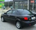 Чорний Кіа Ріо, об'ємом двигуна 1.4 л та пробігом 230 тис. км за 5800 $, фото 2 на Automoto.ua