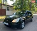 Черный Киа Рио, объемом двигателя 1.4 л и пробегом 235 тыс. км за 3200 $, фото 1 на Automoto.ua
