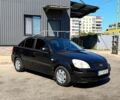 Чорний Кіа Ріо, об'ємом двигуна 1.4 л та пробігом 235 тис. км за 3200 $, фото 1 на Automoto.ua