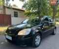 Черный Киа Рио, объемом двигателя 1.4 л и пробегом 235 тыс. км за 3200 $, фото 1 на Automoto.ua
