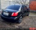 Чорний Кіа Ріо, об'ємом двигуна 1.4 л та пробігом 320 тис. км за 4400 $, фото 4 на Automoto.ua