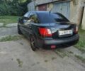 Черный Киа Рио, объемом двигателя 1.4 л и пробегом 270 тыс. км за 3868 $, фото 5 на Automoto.ua