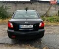 Чорний Кіа Ріо, об'ємом двигуна 1.4 л та пробігом 245 тис. км за 3900 $, фото 4 на Automoto.ua