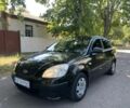Черный Киа Рио, объемом двигателя 1.4 л и пробегом 235 тыс. км за 3200 $, фото 1 на Automoto.ua